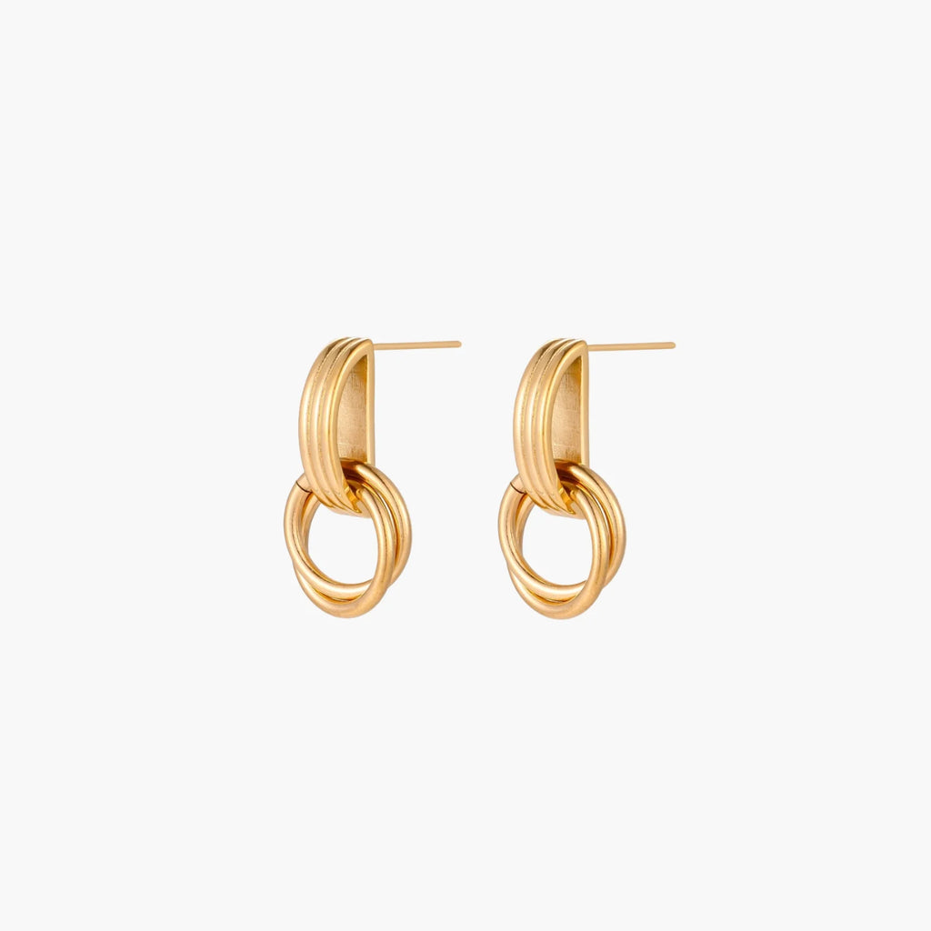Gold stud earrings with vertical ridged bar connecting to triple interlocking circular rings on white background
